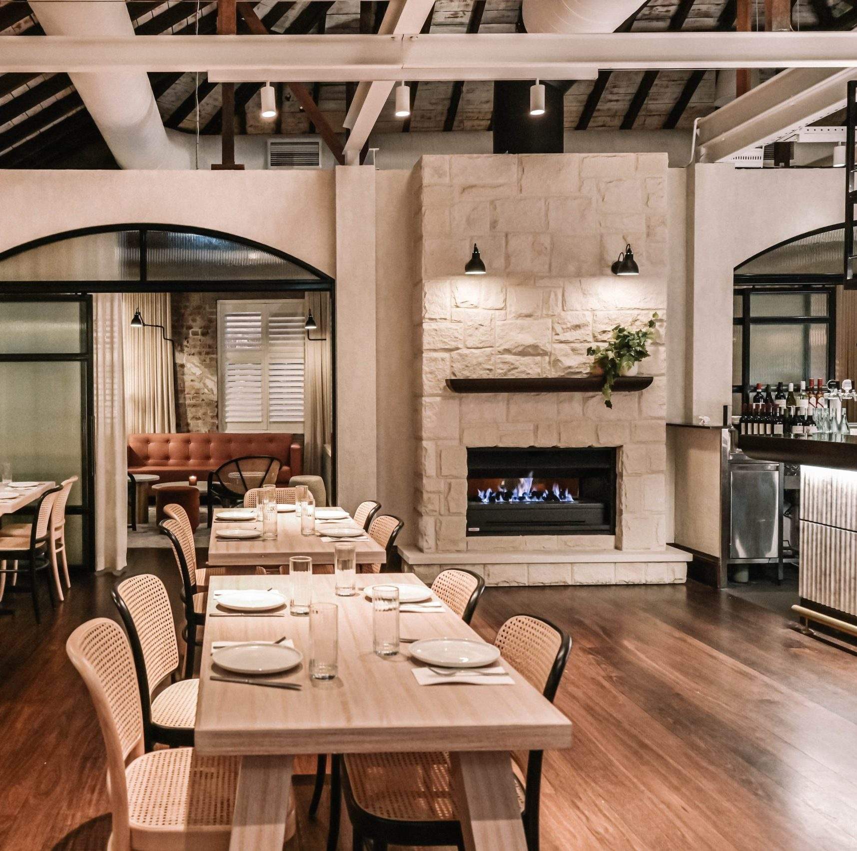 Sofia on Cleveland's elegant interiors with fireplace, exposed white brick walls and high ceilings. Must-Book restaurants, Sydney