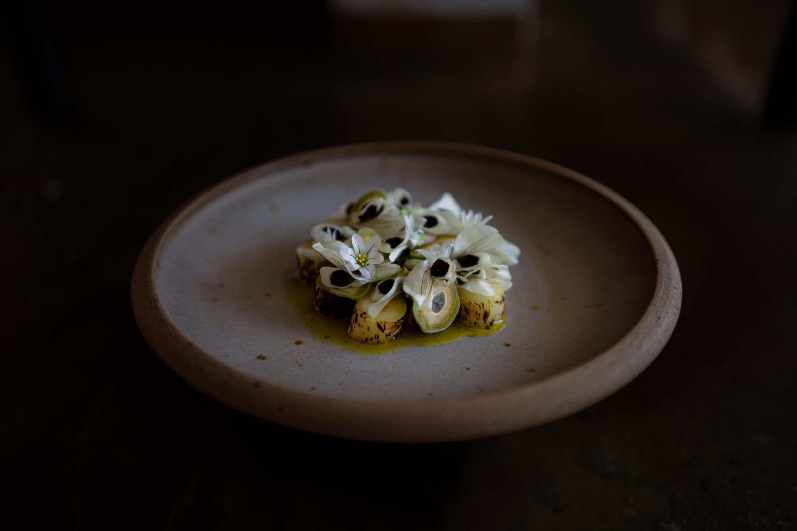 White asparagus, green almond and yoghurt dish with flowers at JAMES restaurant, Melbourne