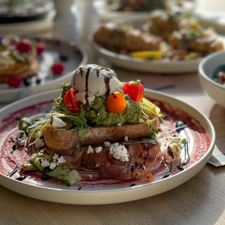 An avocado toast topped with a poached egg at The Deck Brighton, a restaurant in Melbourne