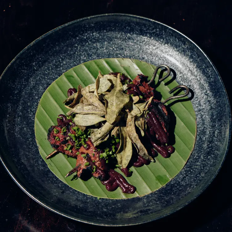 Two skewers sit on a banana leaf at Mesa Verde, one of the most romantic restaurants in Melbourne.