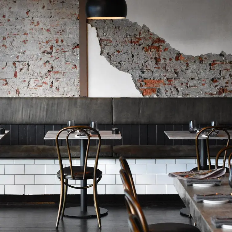 Concrete walls and industrial sitting at Oster, a restaurant in Melbourne