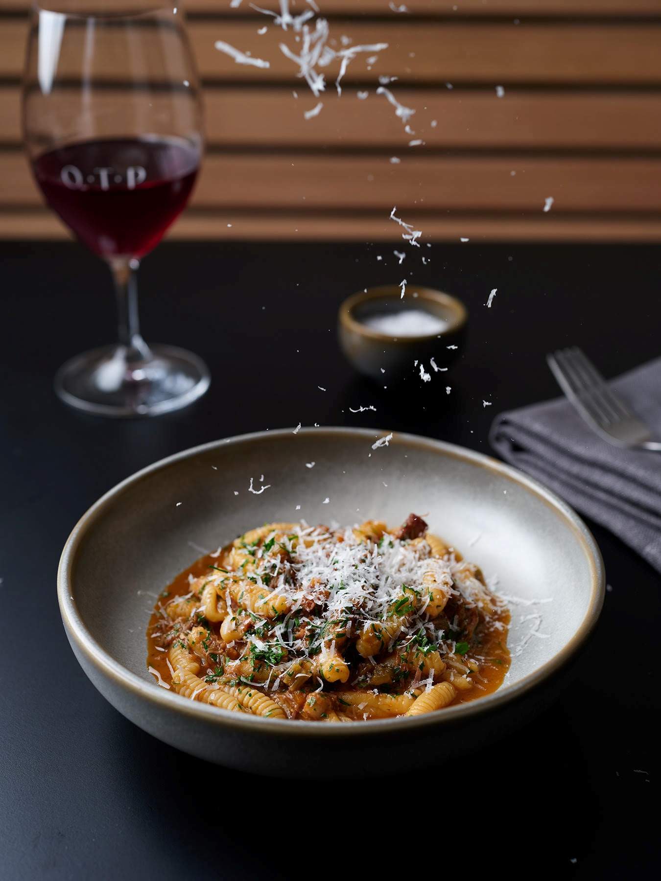 Braised goat cavatelli dish with grated cheese and wine pairing at One Trick Pony, a restaurant in Melbourne.