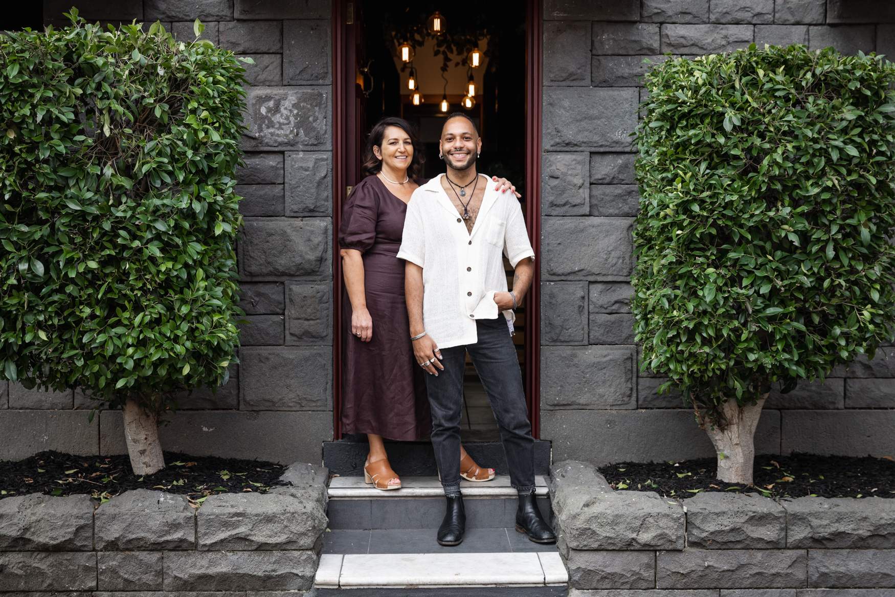 Luciana Pasinetti standing next to Sebastian Pasinetti outside of OKO Restaurant