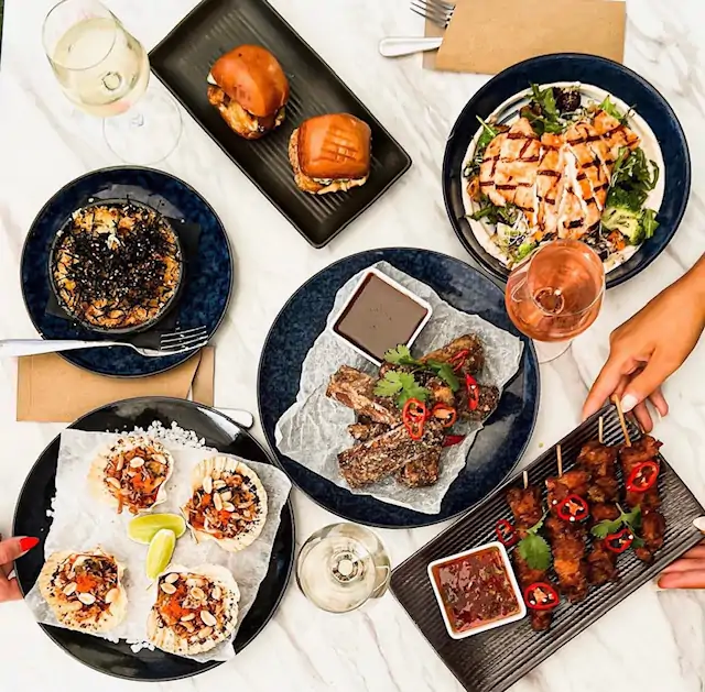 A spread of pub dishes at The Balmain Hotel, one of the best pubs in Sydney