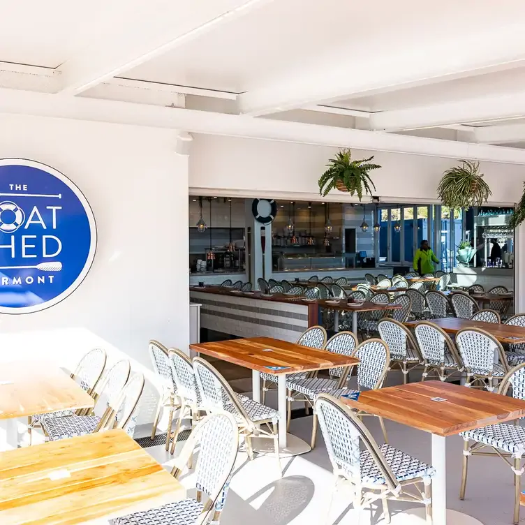 Bright and airy dining interiors at The Boatshed, a restaurant in Sydney