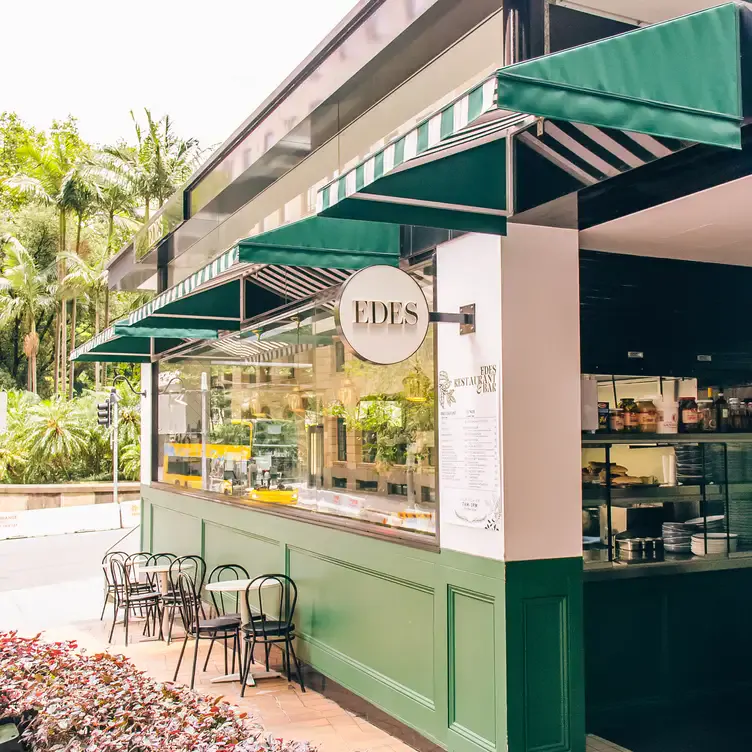 The green and white facade with outdoor seating at Edes, a restaurant in Sydney CBD