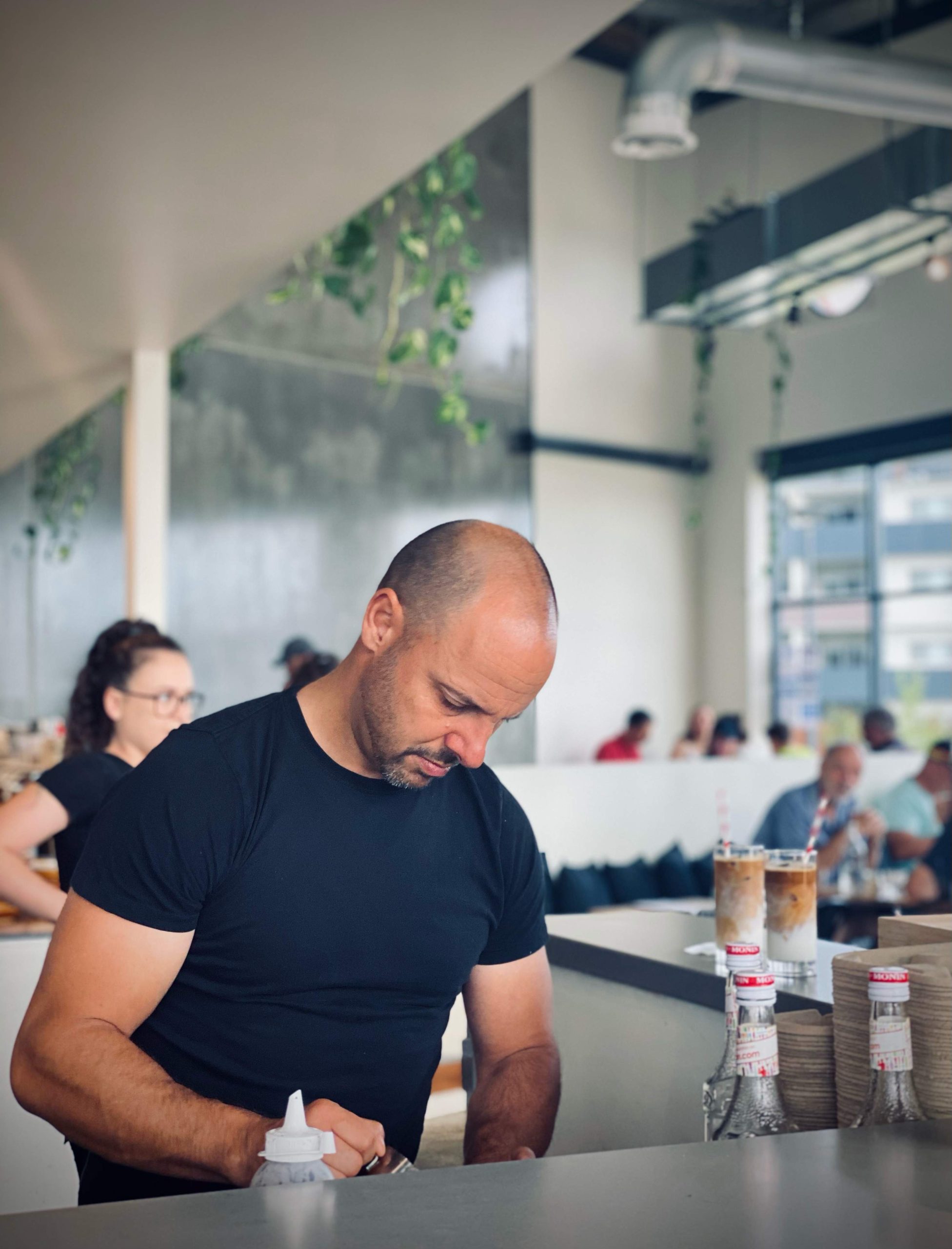 A man making a drink at Canberra cafe Two Before Ten