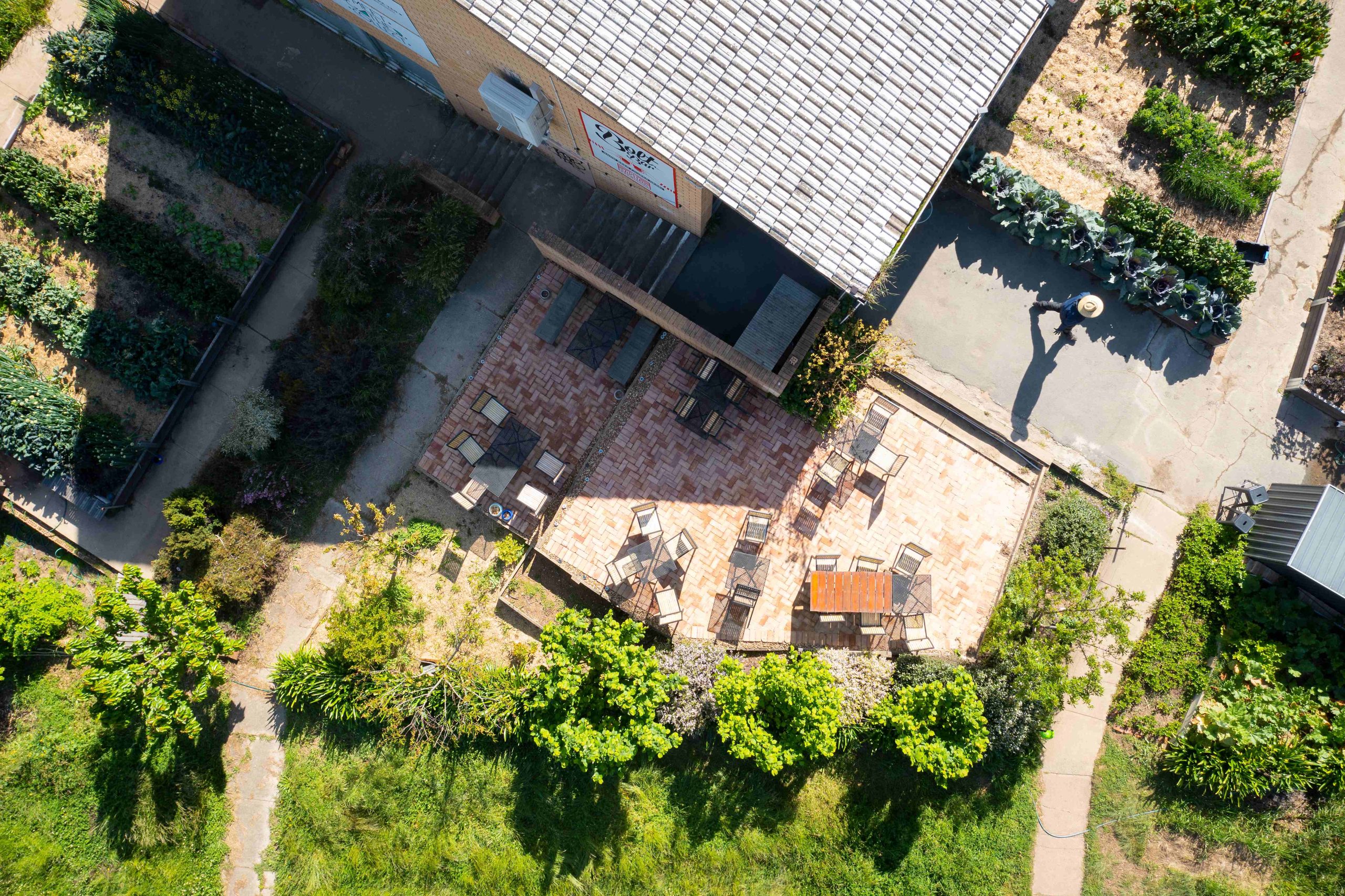 A bird’s-eye view of the outdoor courtyard and garden at Two Before Ten cafe’s Aranda campus.