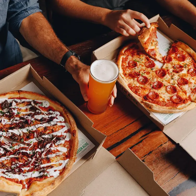 Pizzas and beers at Green Acre Pizza Bar, one of the best vegan pizzerias in Melbourne