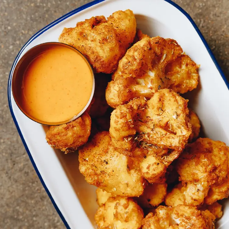 Crispy cauliflower chips served with sriracha mayo at Green Acre Pizza Bar, one of the best vegan pizzerias in Melbourne