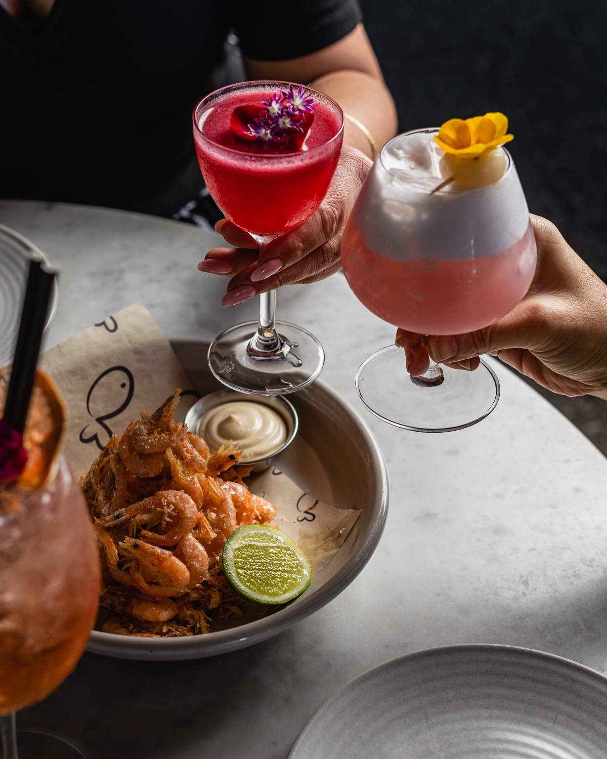 Pink cocktails and prawns at love.fish in Barangaroo