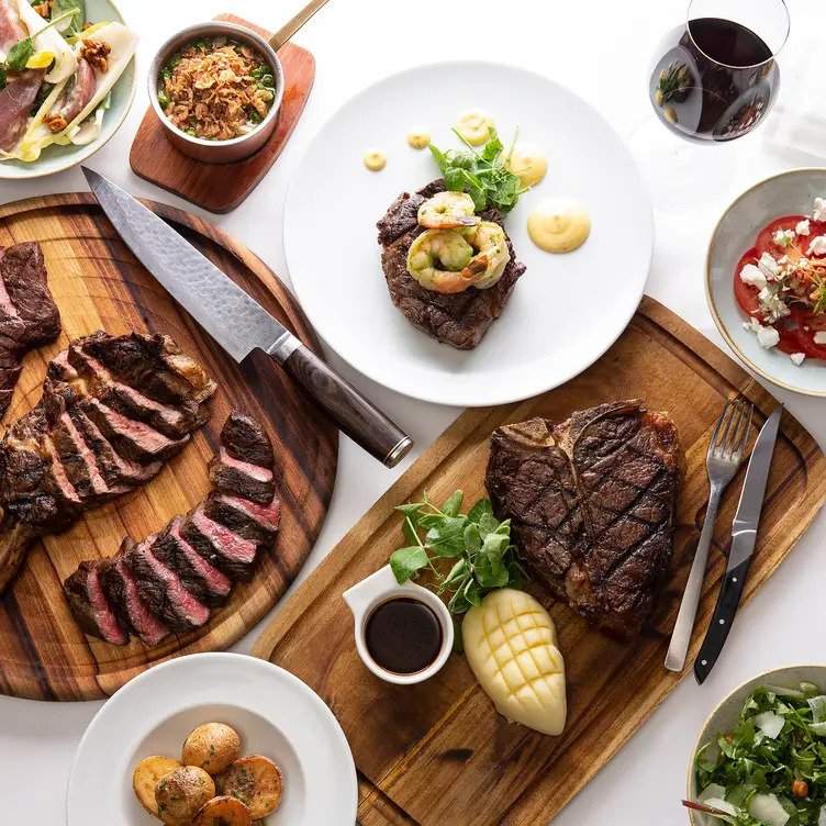 A spread of beef dishes and sides at Steersons Steakouse, a restaurants in Sydney