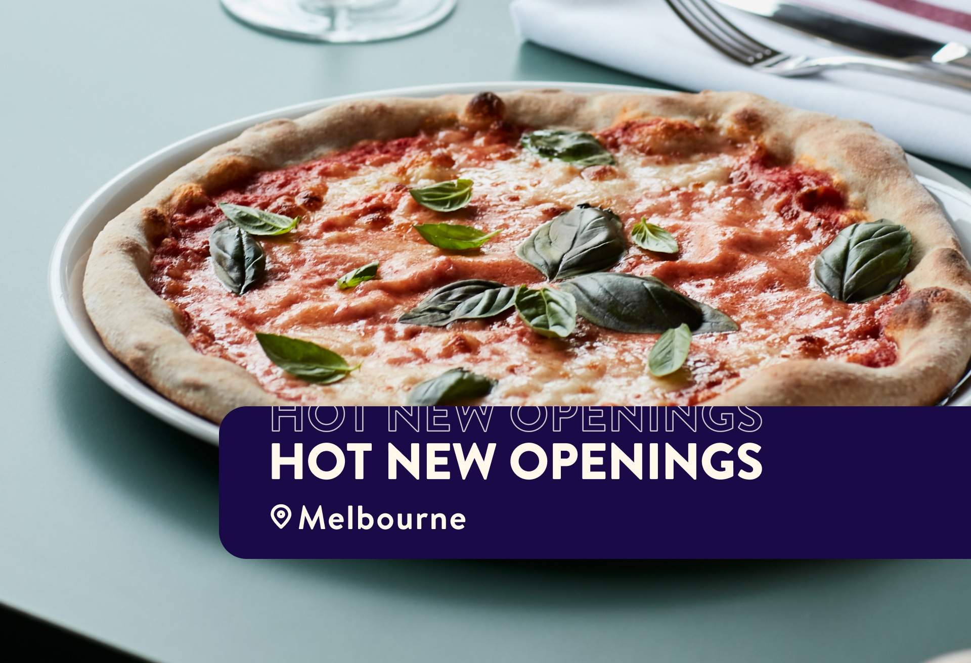 Roman-style pizza topped with Italian tomatoes, fior di latte, basil, and extra virgin olive oil sits atop a table at Grazia Restaurant in Melbourne.