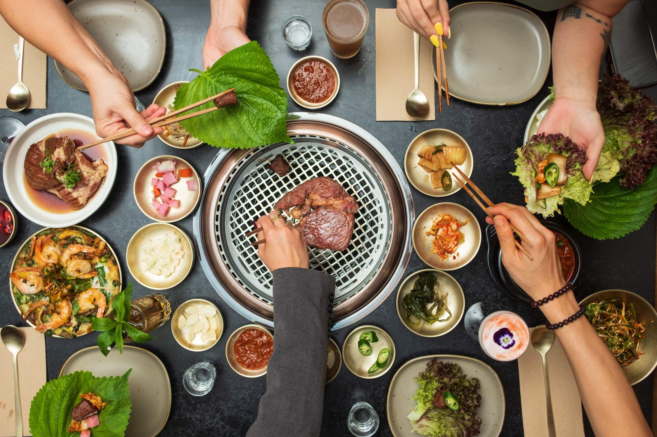 Korean snacks (banchan) and wagyu on a smokeless grill at SOOT in Barangaroo