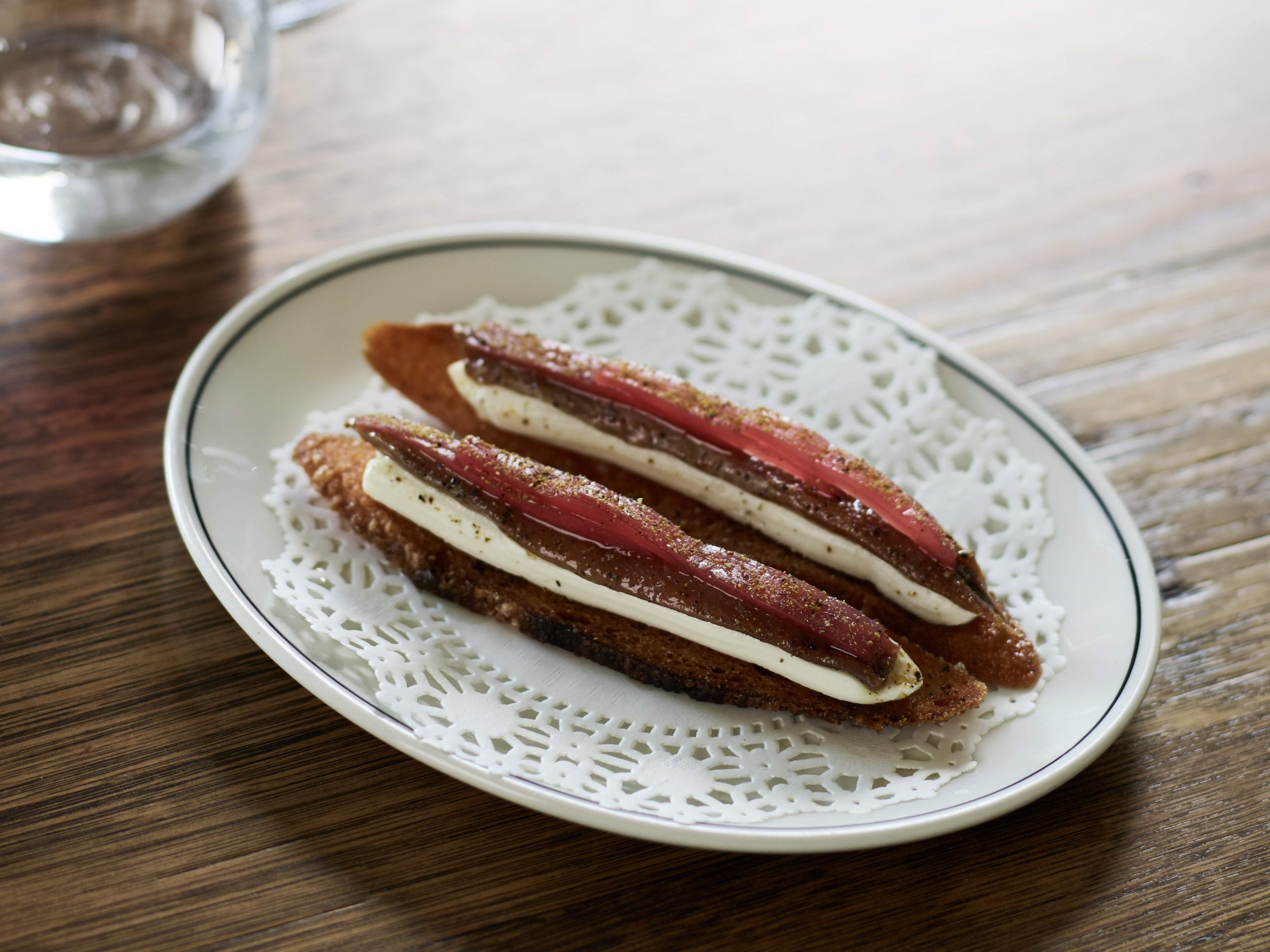 Anchovies on fried bread with ricotta and pickled cucumber at The Carlton Wine Room in Melbourne, one of the best restaurants in Australia