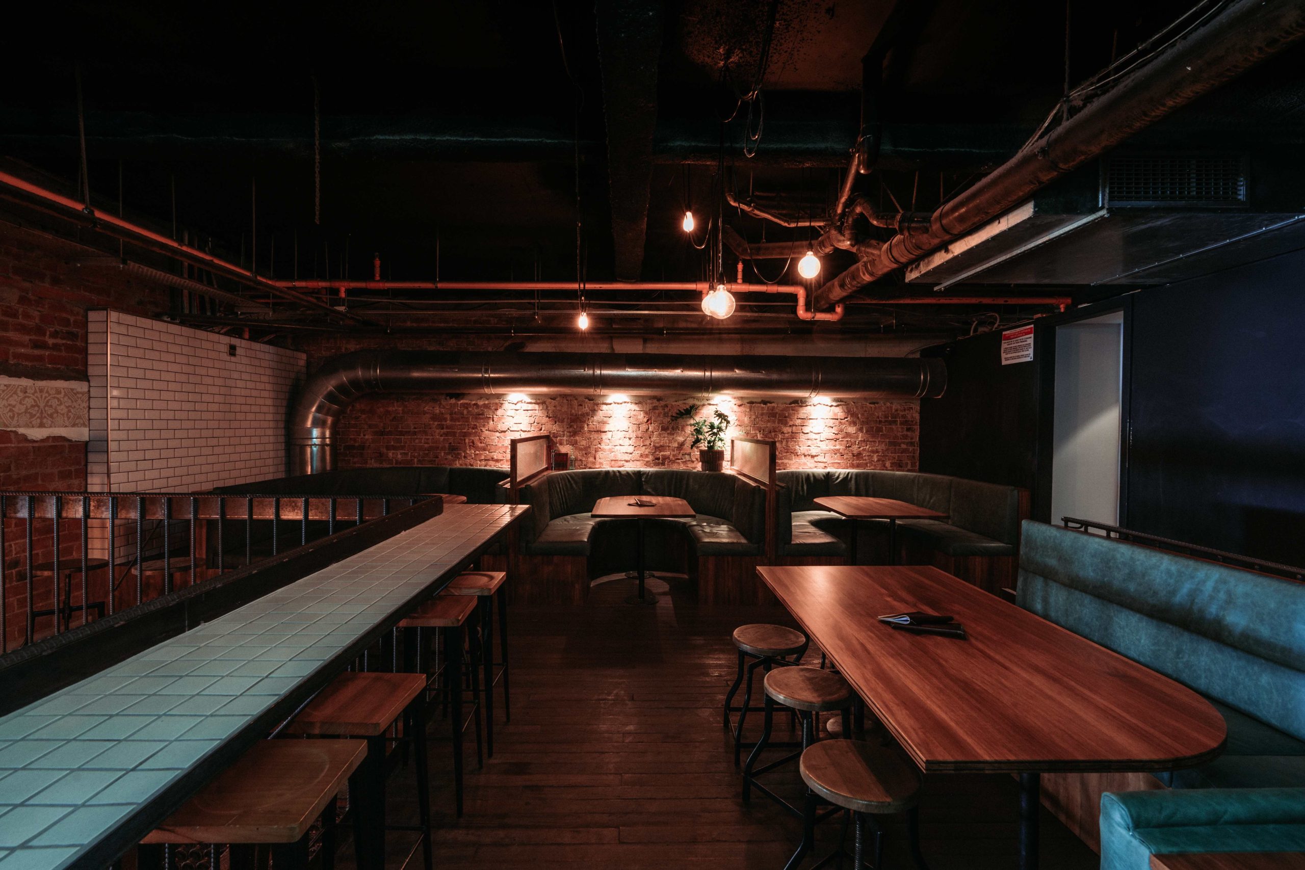 Exposed brick and intimate booths at Udaberri Pintxos y Vino in Adelaide, one of the best restaurants in Australia