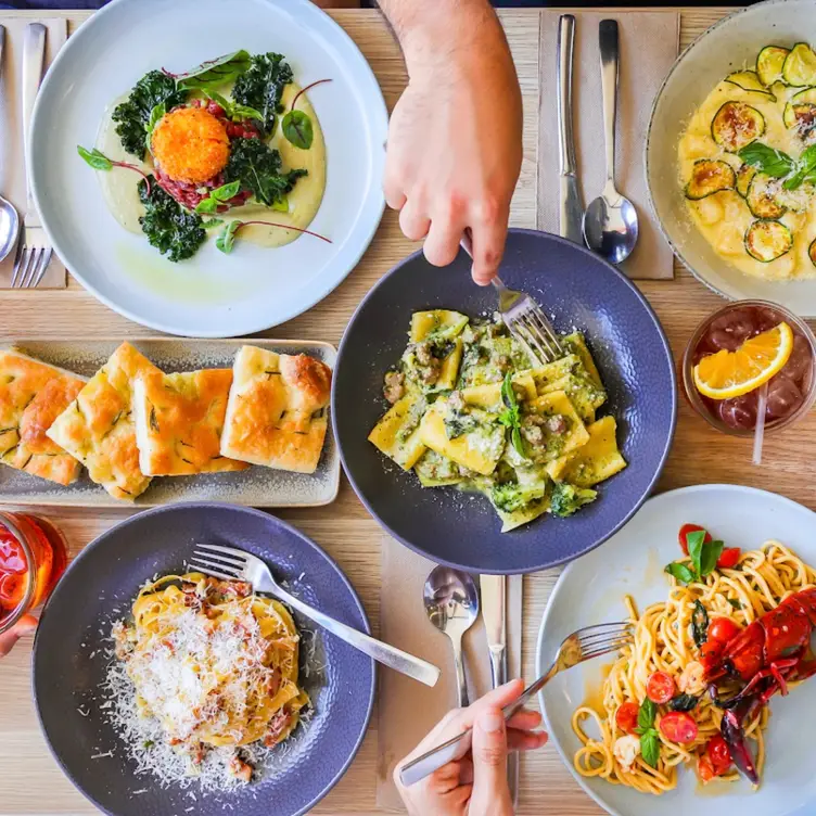 A table packed with different dishes from La Favola, one of the best Italian restaurants in Sydney.