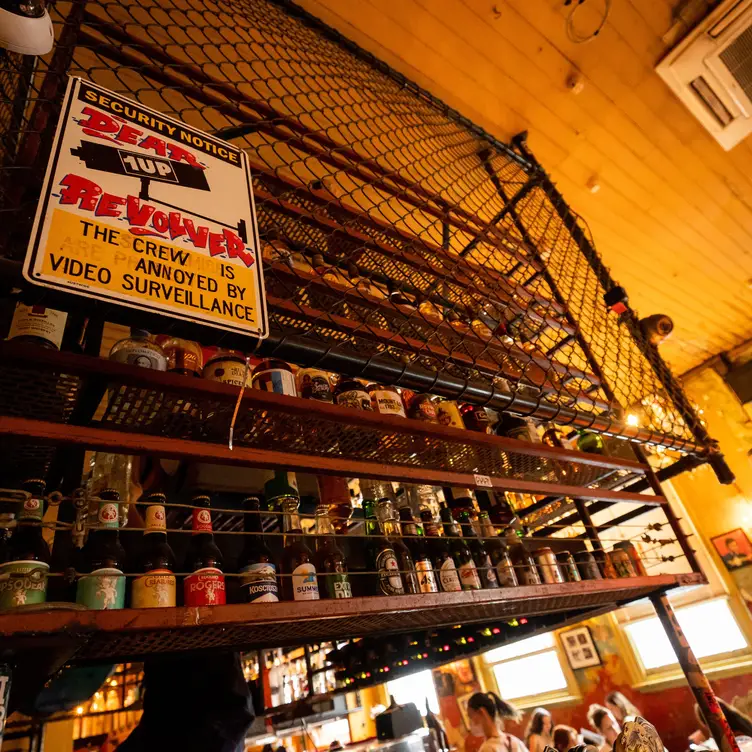 Shelves of drinks behind the bar at Colonel Tan’s – one of the best Melbourne vegetarian restaurants.