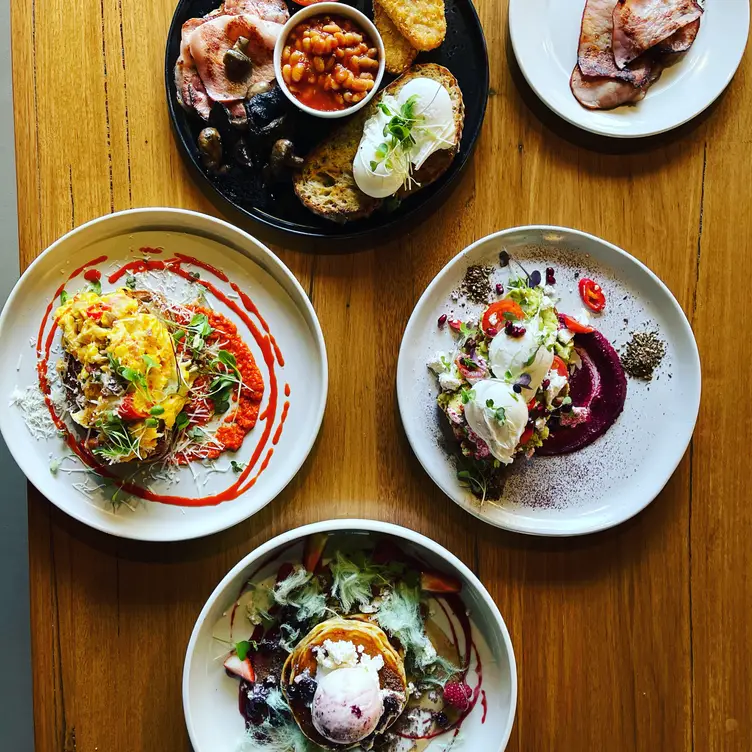 A table spread with pancakes, bacon and other brunch dishes at Freddie’s Kitchen, one of the best steak restaurants in Melbourne. Credit: Freddie’s Kitchen