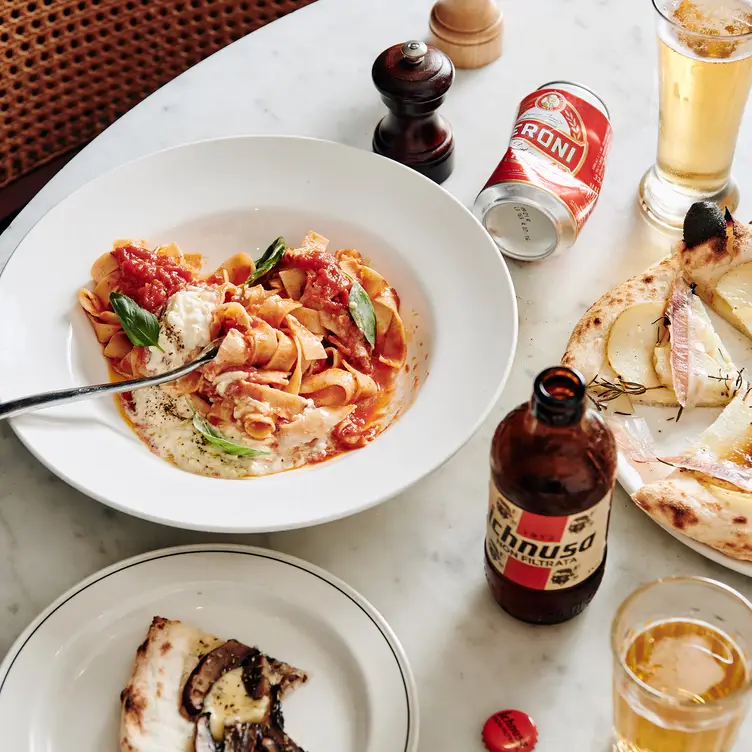 A bowl of pasta, served alongside pizza and drinks at Gilson, one of the best Italian restaurants in Melbourne. Credit: Gilson