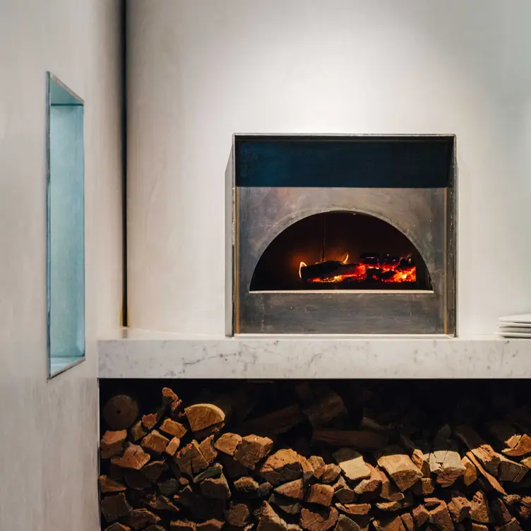 The fireplace and wood at Gilson, one of the best Italian restaurants in Melbourne for private dining. Credit: Gilson