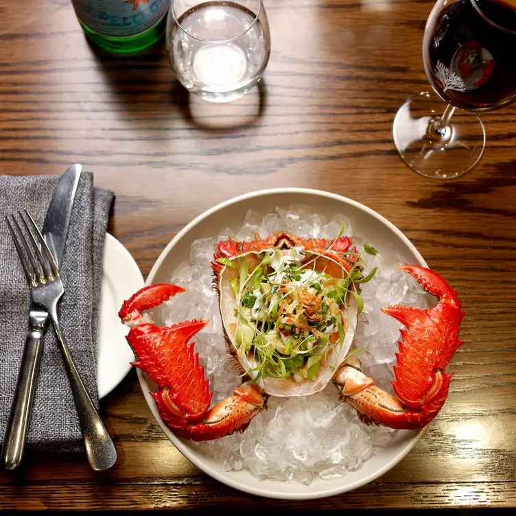 A crab dish and wine at Lamaro’s Hotel, one of the best steak restaurants in Melbourne. Credit: Lamaro’s Hotel