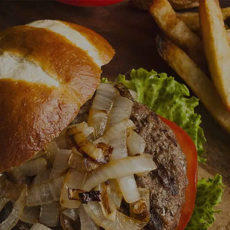 Close-up of a burger and chips at Mama’s Steakhouse, one of the best steak restaurants in Sydney. Credit: Mama’s Steakhouse