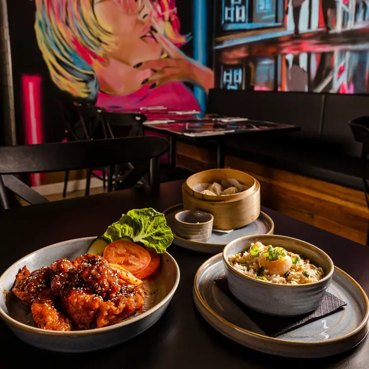 Three dishes on a table at Mr Wabi, one of Brisbane’s best Asian restaurants.