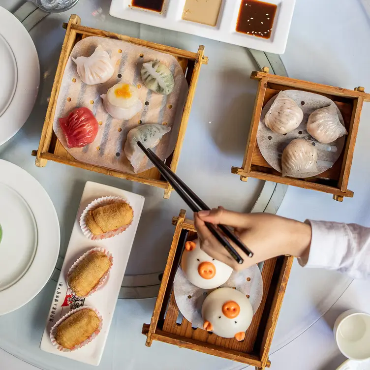 Dishes of dumplings and buns at Secret Kitchen - Chinatown, one of the best Asian restaurants in Melbourne.