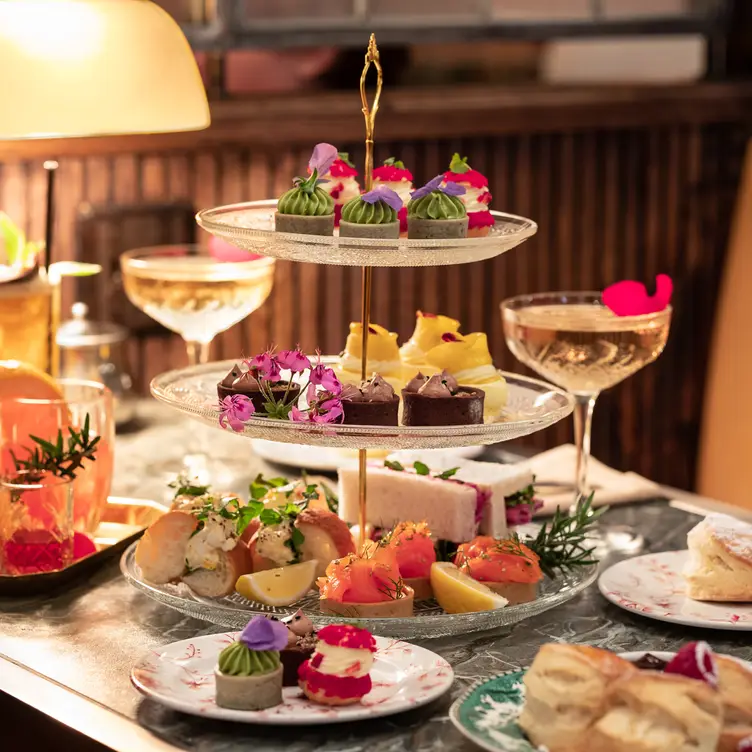 A high-tea display filled with sweets at The Grounds of the City, one of the best steak restaurants in Sydney. Credit: The Grounds of the City