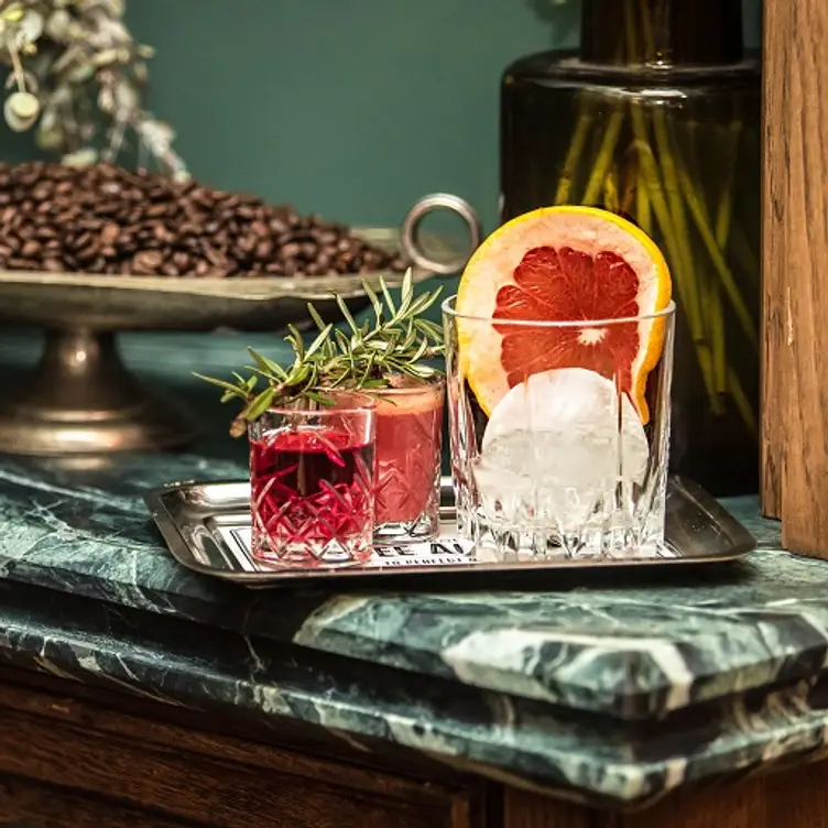 ocktails on a tray with coffee beans in the background at The Grounds of the City, one of the best steak restaurants in Sydney. Credit: The Grounds of the City