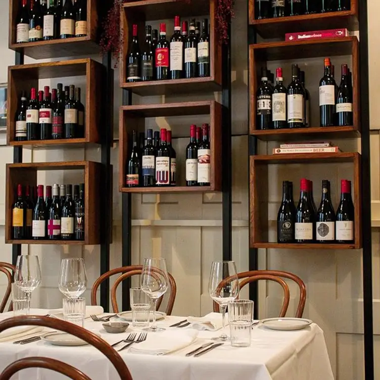 A number of shelves stacked with wine bottles at Trattoria Emilia, one of the best Italian restaurants in Melbourne’s CBD. Credit: Trattoria Emilia