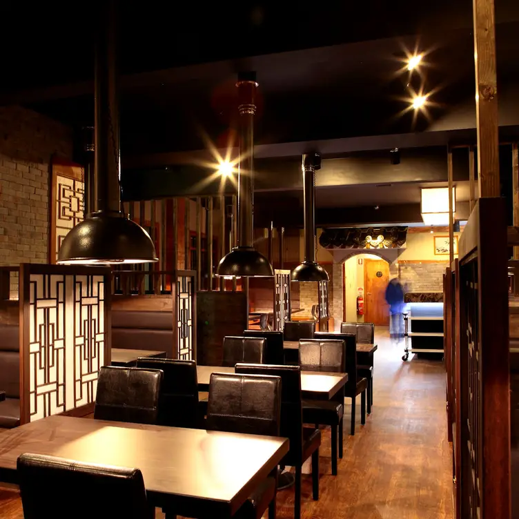 The warmly lit tables and booths inside Yeonga Korean BBQ, one of the best Asian restaurants in Melbourne.