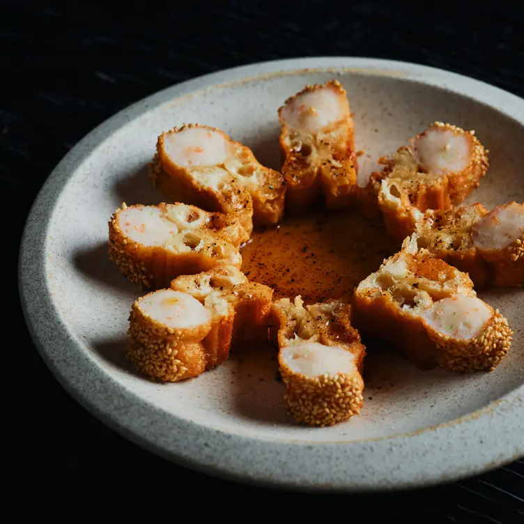 A plate of the prawn toast Chinese doughnuts at Yugen Dining, one of the best Asian restaurants in Melbourne.