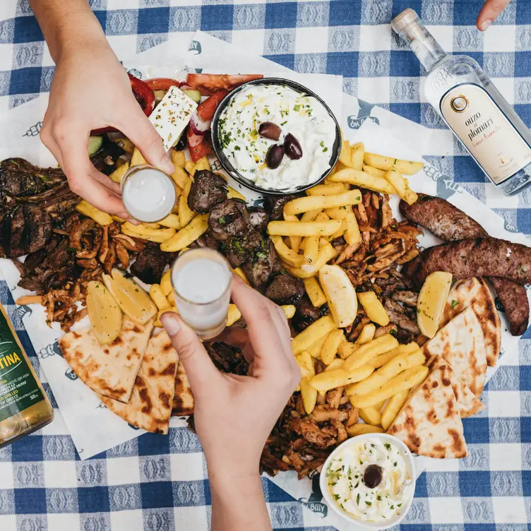 A shared serving of traditional Greek food at Melbourne’s Ok Billy Souvlaki Bar.