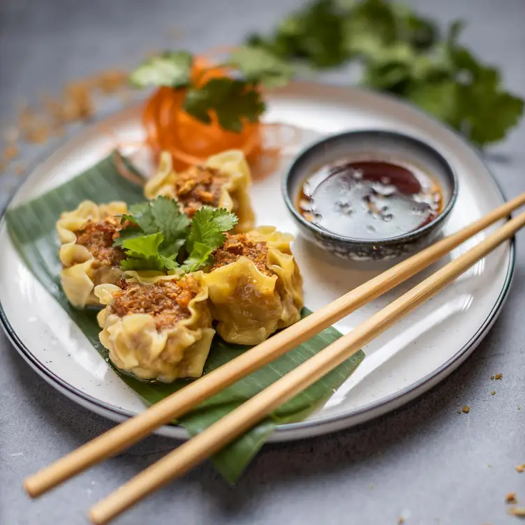 A dish of small bites and dipping sauce served at The Baan Kurrajong, one of the best Thai restaurants in Sydney.