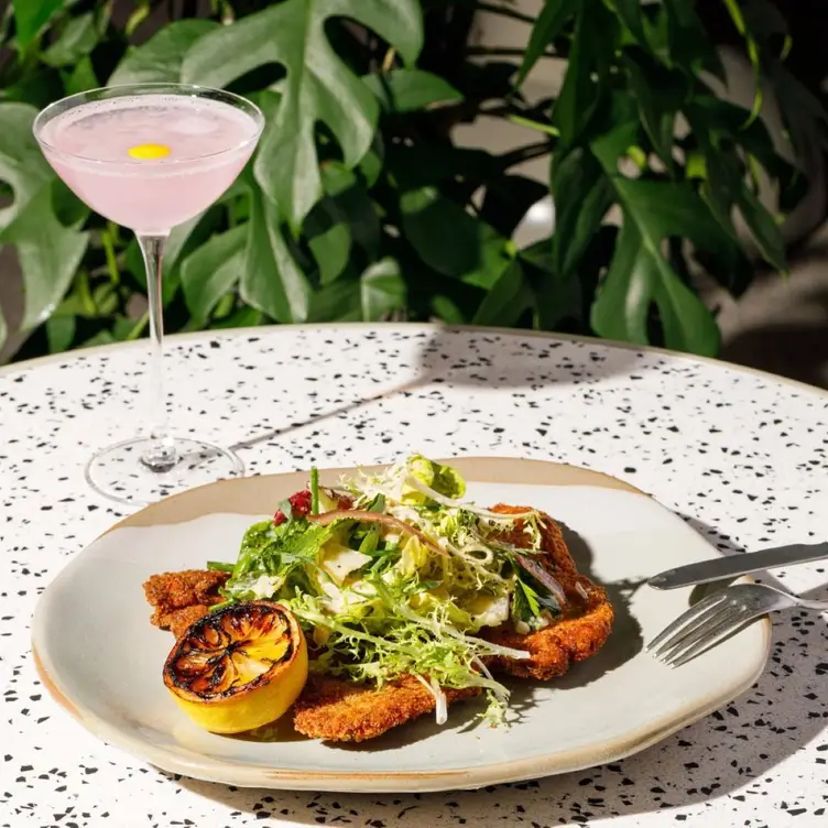 A plate of Greek food and a cocktail served at Danté in Northcote.