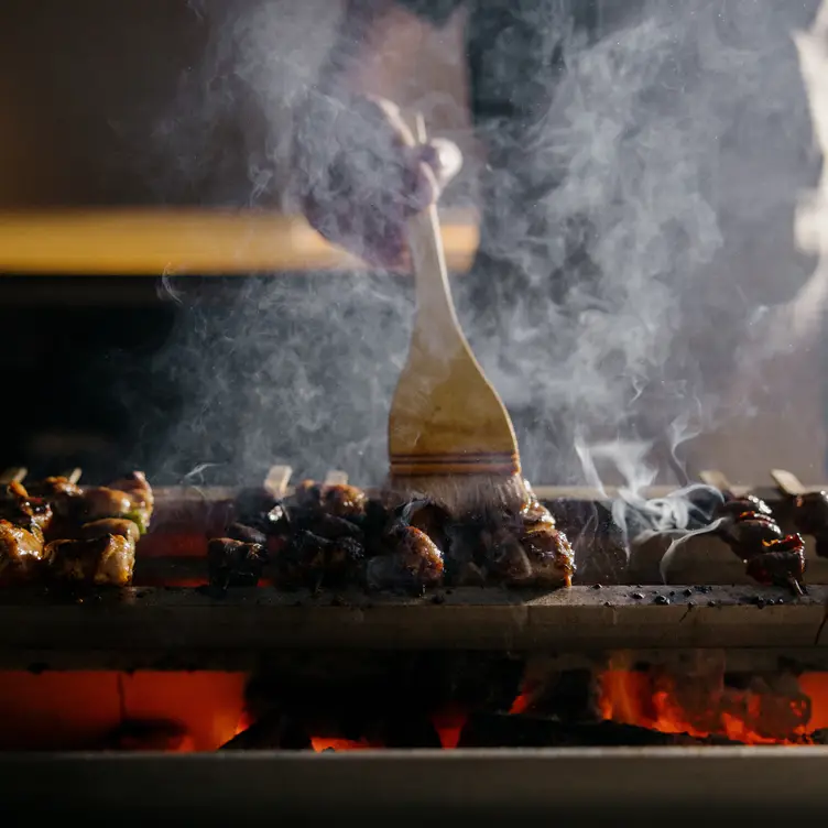 A chef making hay-seared Warayaki Tataki at Izakaya Público in Brisbane.