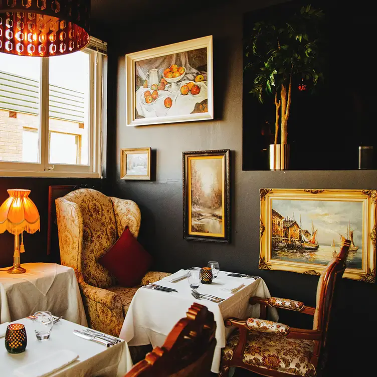 The French Renaissance furniture, antique paintings and old-world elegance of Deer Duck Bistro.