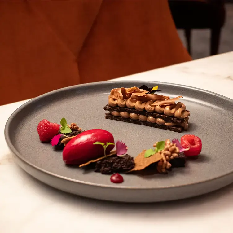 A decadent chocolate and berry dessert served at Signature - Emporium Hotel South Bank, one of Brisbane’s best date night restaurants.