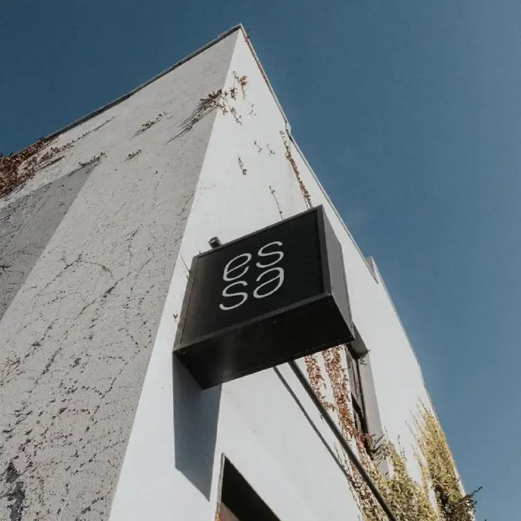 The sign on the wall outside of Essa Restaurant, one of the best romantic restaurants in Brisbane.