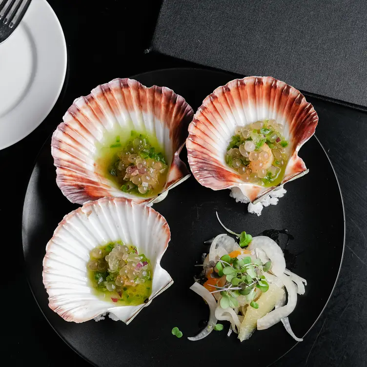 A dish served in clam shells at Vintaged Bar and Grill, one of Brisbane's best seafood restaurants.