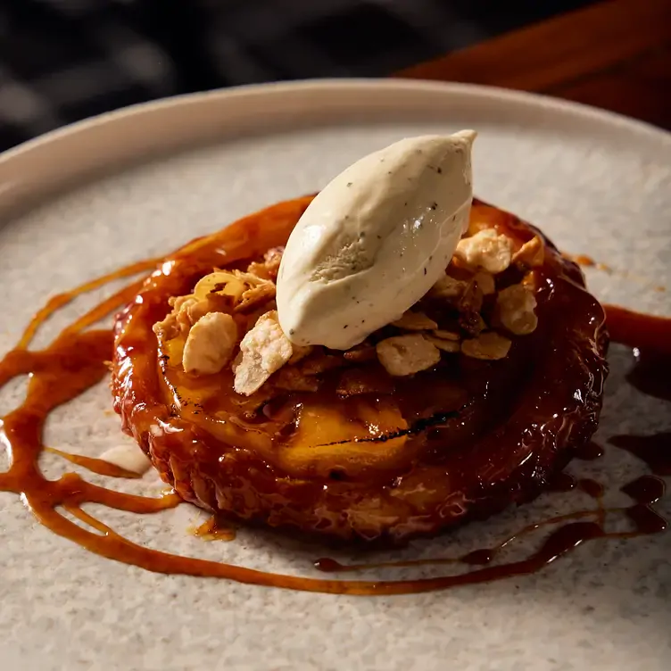 A caramelised pastry dish topped with vanilla ice cream served at Coal Cellar + Grill, one of the most romantic restaurants in Adelaide.