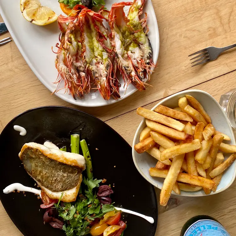 Seafood dishes and chips served at Garfish Crows Nest – declared the best seafood restaurant in Sydney.