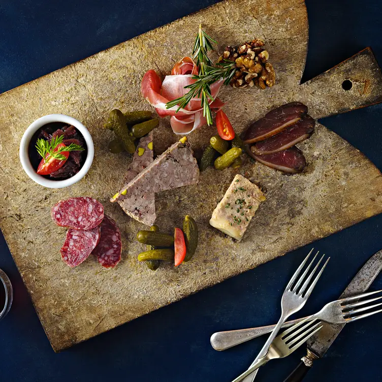 A wooden platter of appetisers served at Chez Olivier Le Bistro in Melbourne.