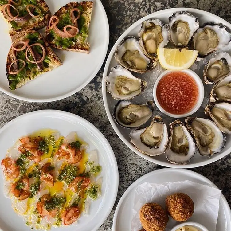 Oysters and other entrees served at Fish Shop Bondi – considered by many to be the best seafood restaurant Sydney has to offer.