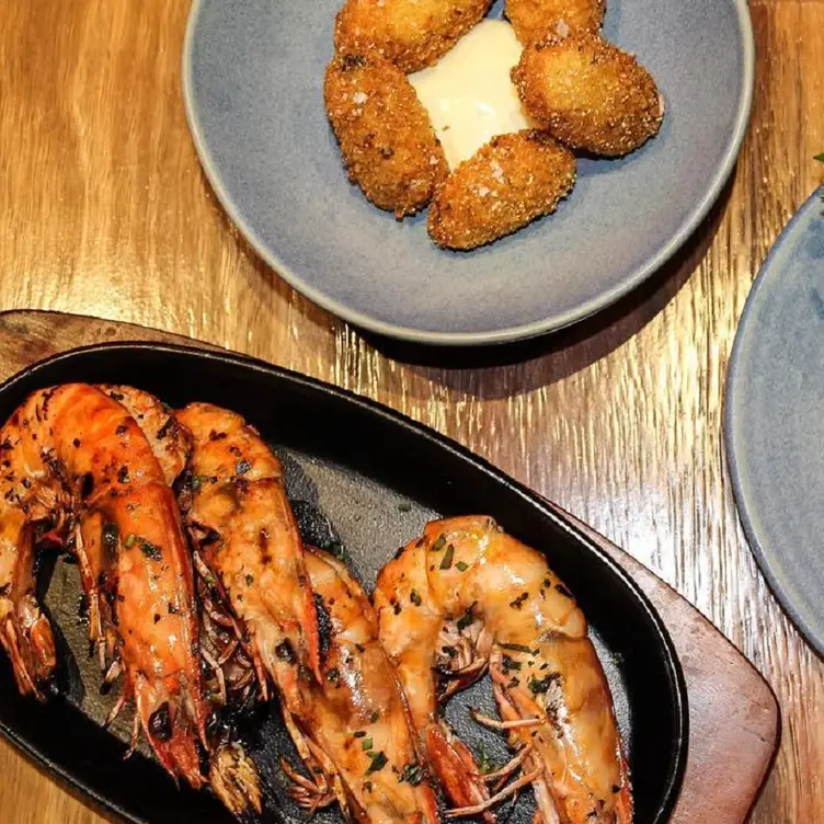 Various dishes served at King Crab Co, one of the best seafood restaurants in Brisbane.