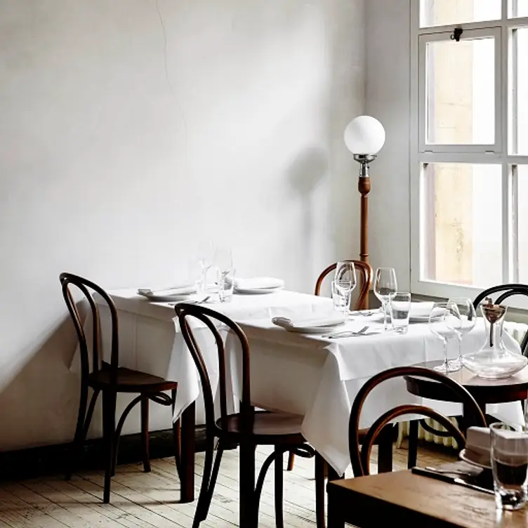 A couple of cosy tables at French Saloon, the best French restaurant in Melbourne’s CBD.