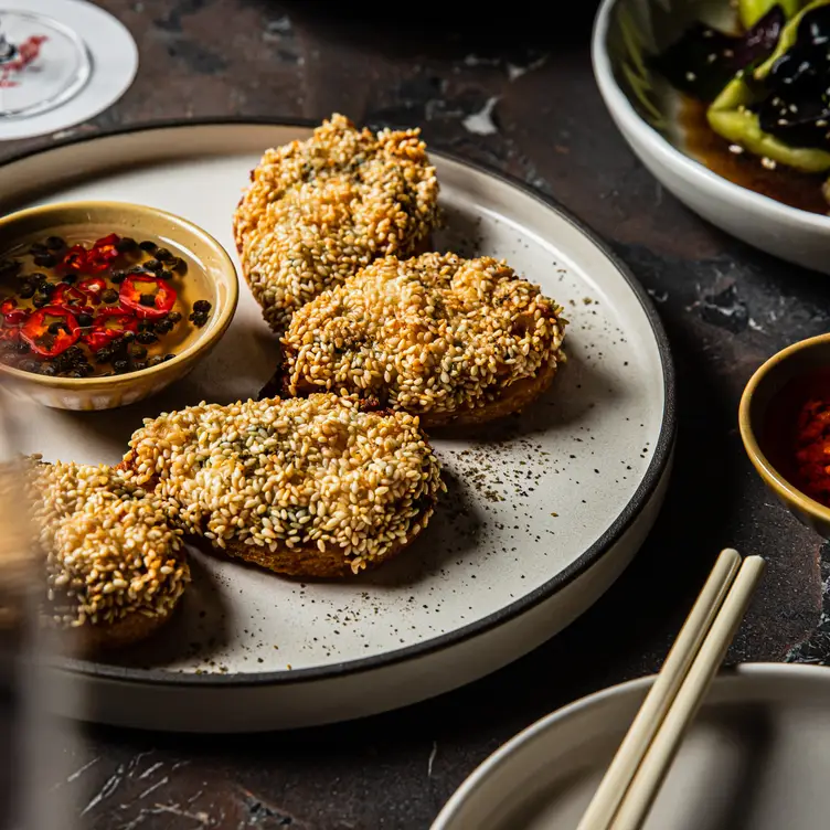 A plate of prawn toast served at Redbird.