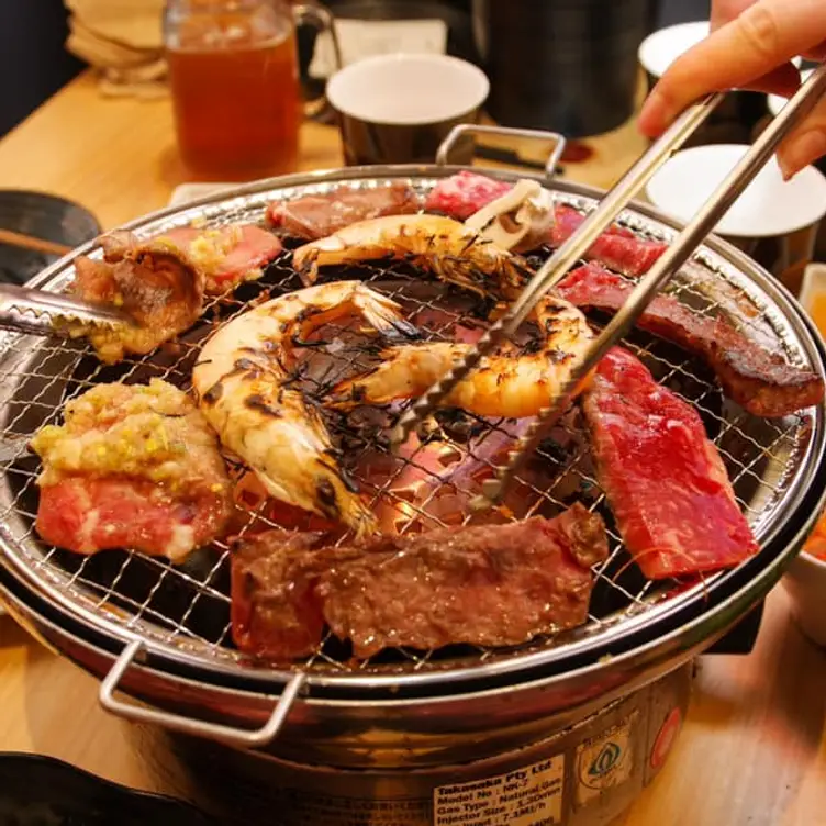 Prawns and meat cooked over the grill at Nikaido Mascot, one of the best Japanese restaurants in Sydney.